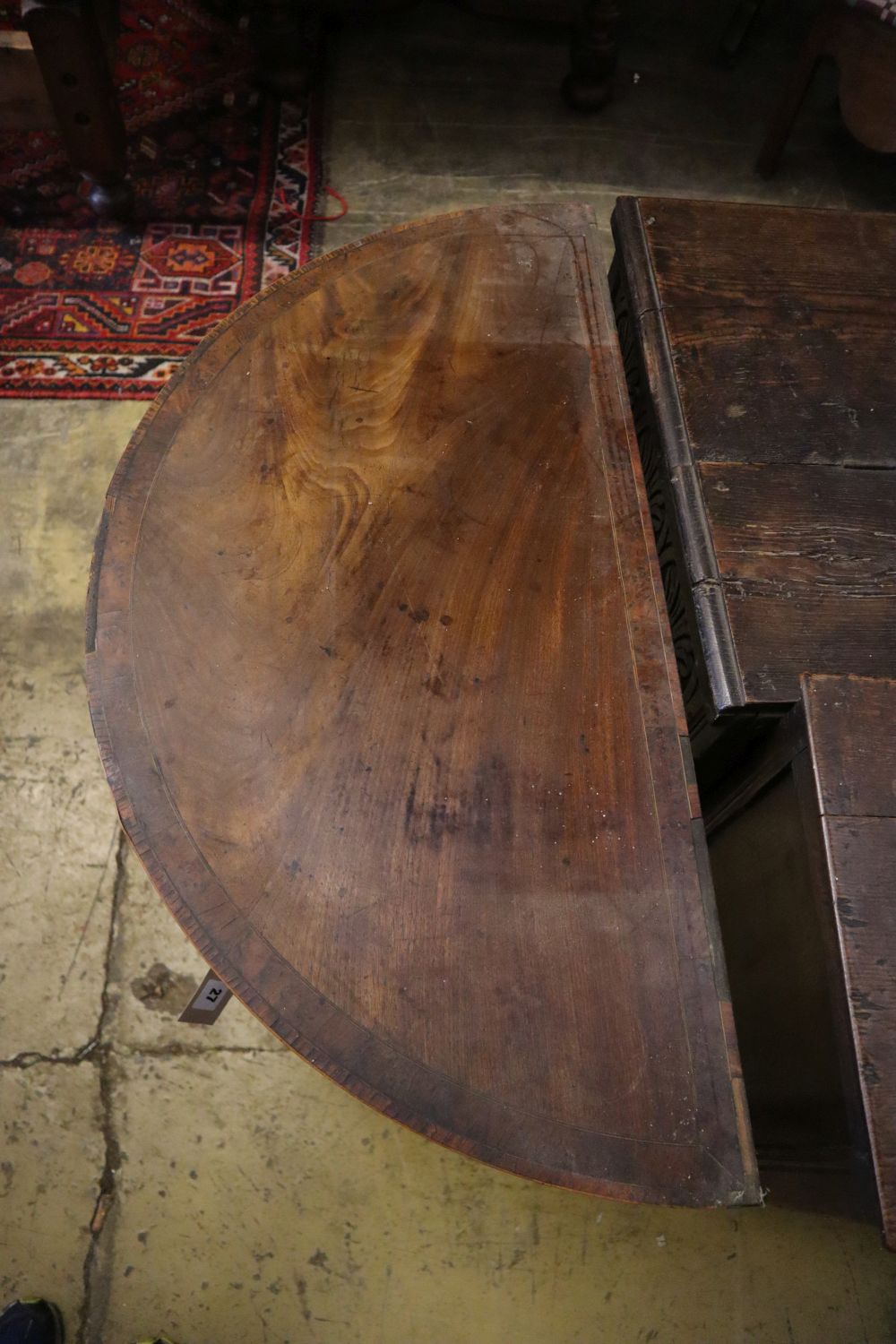 A George III mahogany D shape folding tea table, width 91cm depth 45cm height 75cm